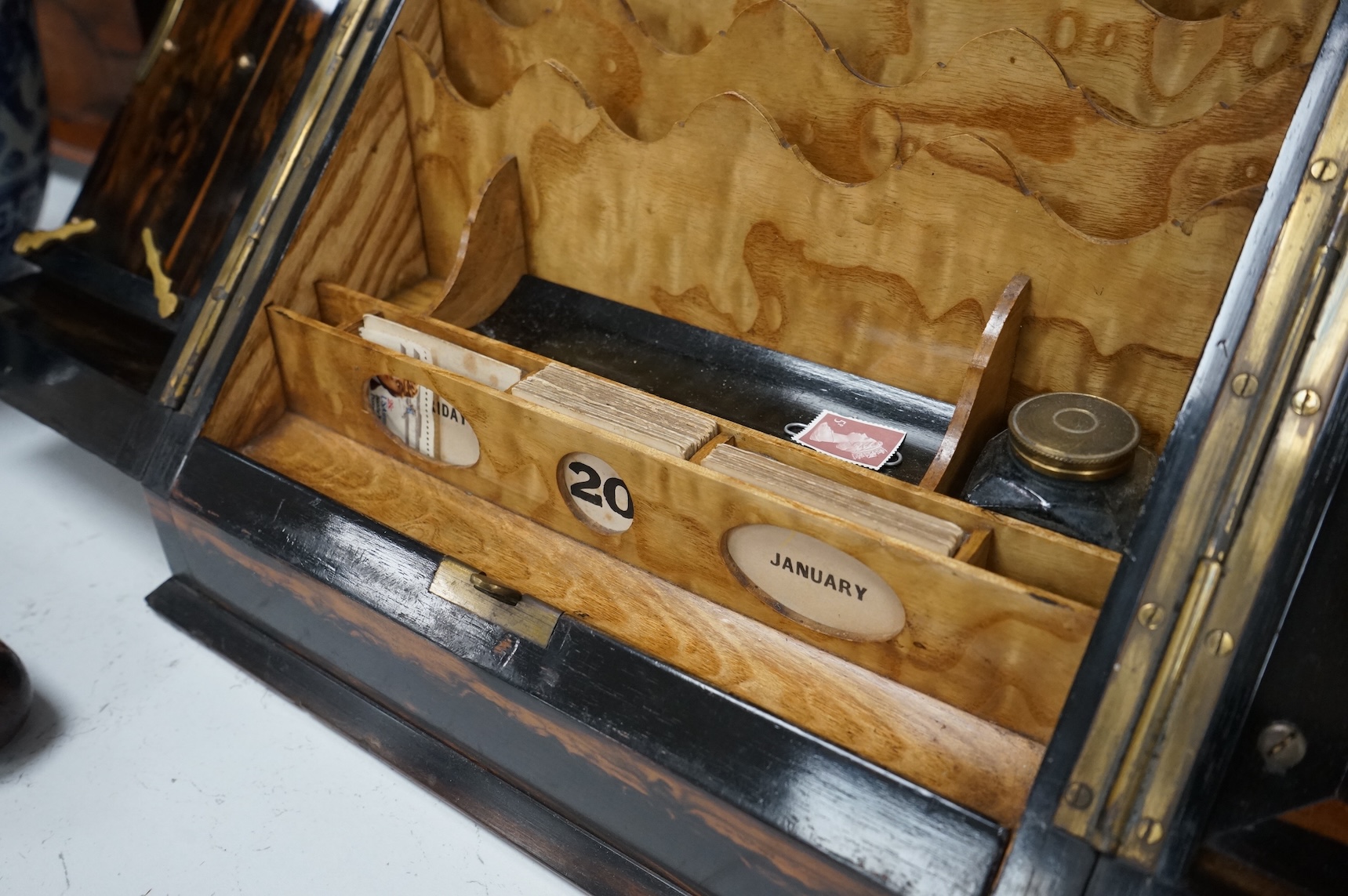 A coromandel desk top stationery box with letter rack and calendar, 29cm wide